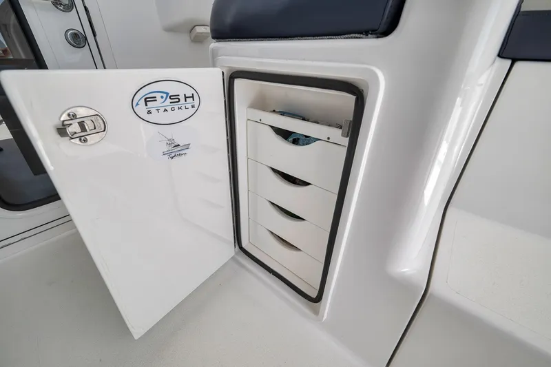 Slide: The Image of Open tackle storage on 2018 Viking 37 Billfish boat, featuring organized fishing gear compartments. - 41