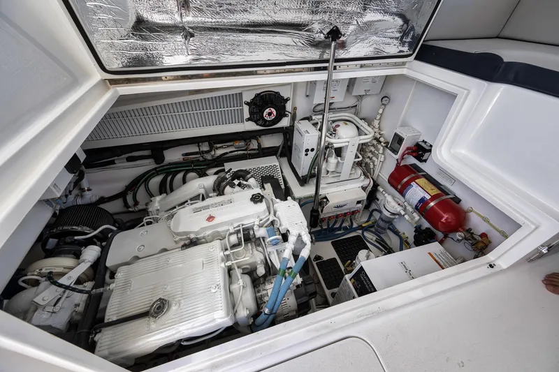 Slide: The Image of Engine compartment of a 2018 Viking 37 Billfish boat, showcasing mechanical components. - 44