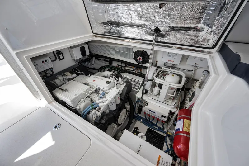 Slide: The Image of Engine compartment of 2018 Viking 37 Billfish boat, showcasing mechanical components and systems. - 45