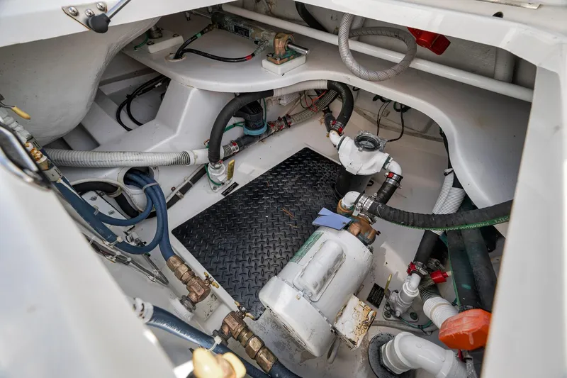 Slide: The Image of Engine compartment of 2018 Viking 37 Billfish boat, showcasing hoses and mechanical components. - 47