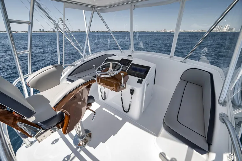 Slide: The Image of 2018 Viking 37 Billfish helm with modern controls and ocean view. - 55