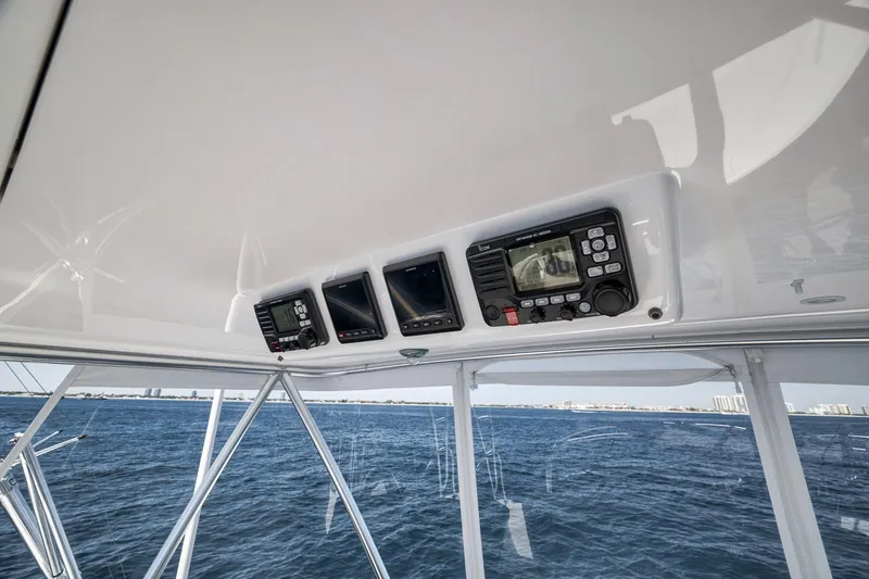 Slide: The Image of 2018 Viking 37 Billfish helm electronics with ocean view in background. - 56