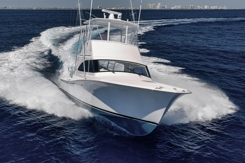 Slide: The Image of 2018 Viking 37 Billfish yacht cruising on open ocean waters. - 6