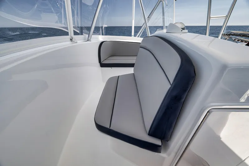 Slide: The Image of 2018 Viking 37 Billfish boat interior with cushioned seating and ocean view. - 60