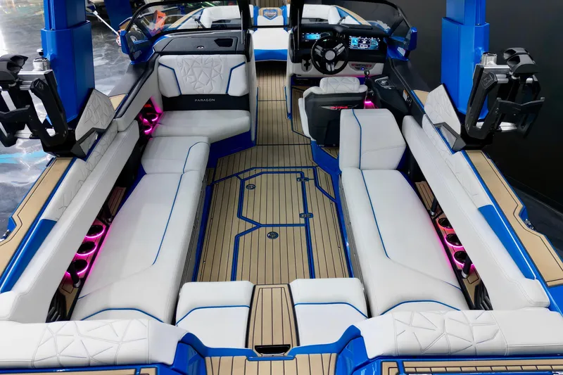 Slide: The Image of 2022 Nautique Super Air Nautique G25 Paragon interior with luxurious seating and modern dashboard. - 11
