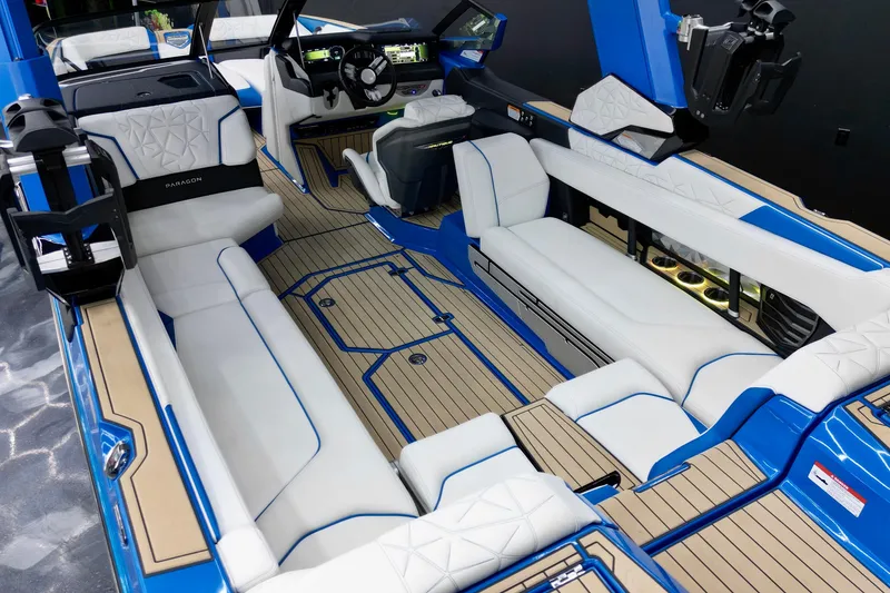 Slide: The Image of 2022 Nautique Super Air Nautique G25 Paragon interior with luxurious seating and modern dashboard. - 12