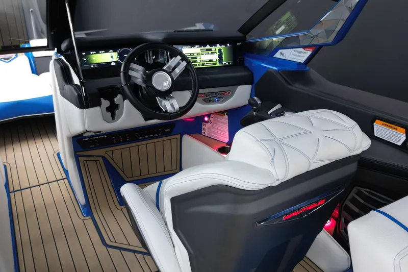 Slide: The Image of 2022 Nautique Super Air Nautique G25 Paragon cockpit with modern dashboard and luxurious seating. - 14