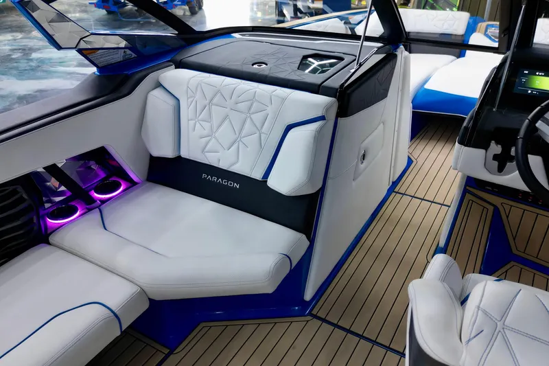 Slide: The Image of Luxurious interior of 2022 Nautique Super Air Nautique G25 Paragon with elegant seating and ambient lighting. - 16