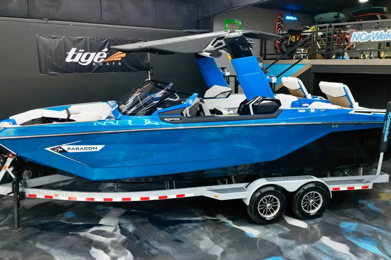 The Image of 2022 Nautique Super Air Nautique G25 Paragon boat on trailer in showroom. - 2