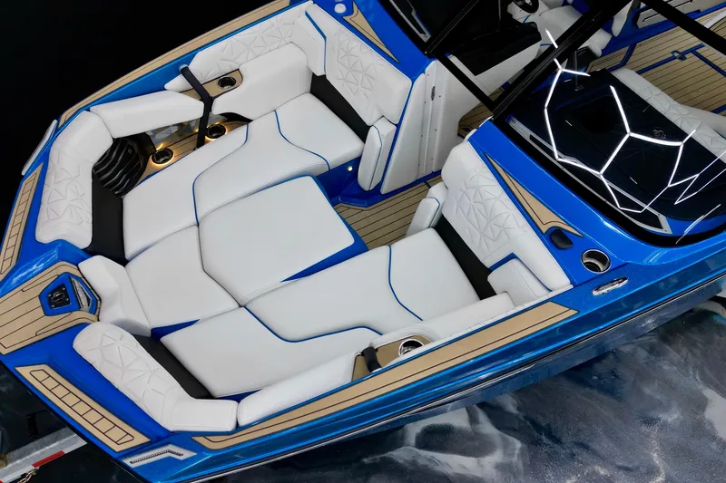 Slide: The Image of 2022 Nautique Super Air Nautique G25 Paragon interior with blue and white luxury seating. - 21