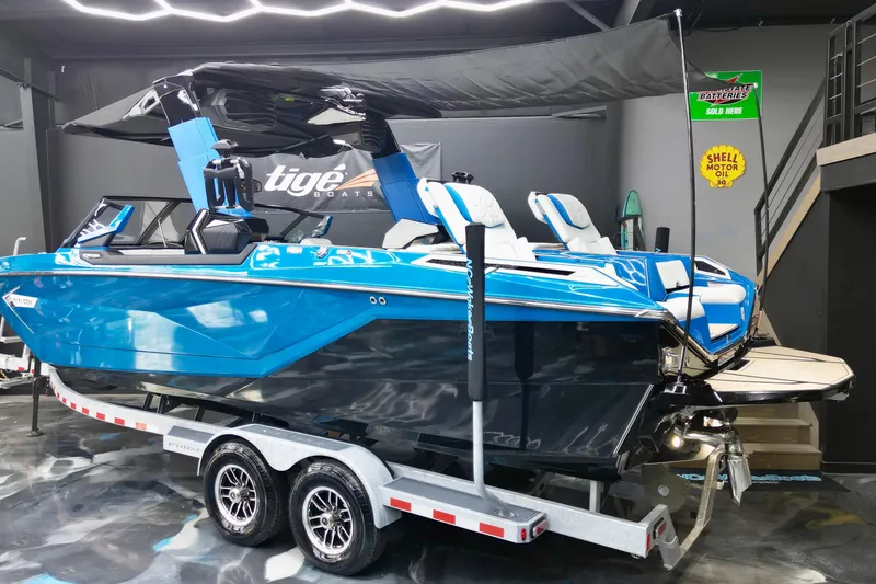 Slide: The Image of 2022 Nautique Super Air Nautique G25 Paragon boat on trailer in showroom. - 23