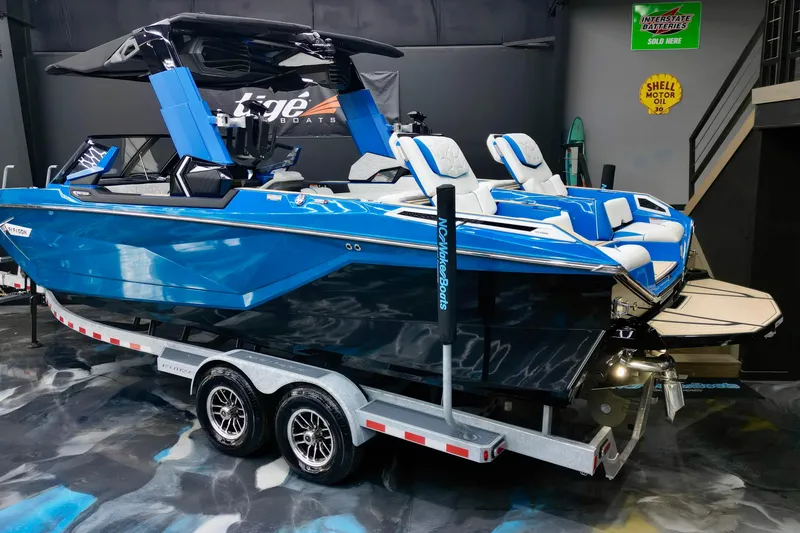 Slide: The Image of 2022 Nautique Super Air Nautique G25 Paragon boat in showroom on trailer. - 4