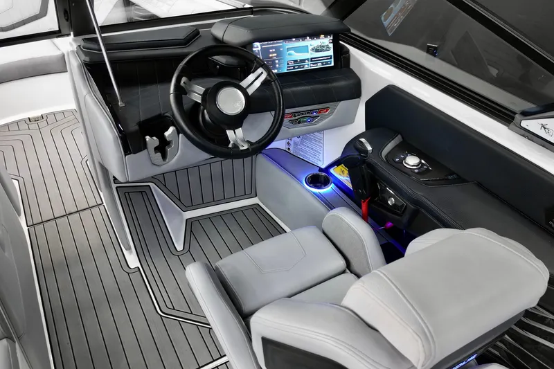 Slide: The Image of 2024 Nautique Super Air Nautique G23 cockpit with modern controls and sleek design. - 10