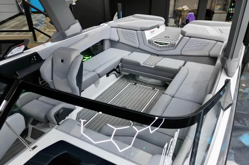 Slide: The Image of 2024 Nautique Super Air Nautique G23 interior with luxurious seating and modern design. - 12