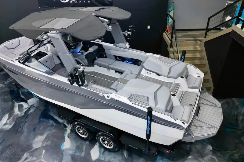 Slide: The Image of 2024 Nautique Super Air Nautique G23 boat, sleek design, spacious interior, on display indoors. - 15