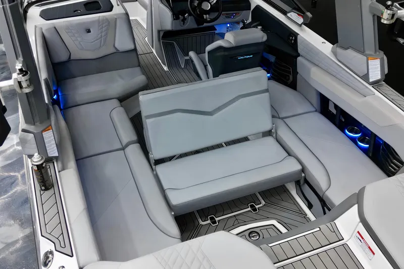 Slide: The Image of 2024 Nautique Super Air Nautique G23 interior with luxurious seating and modern design. - 19