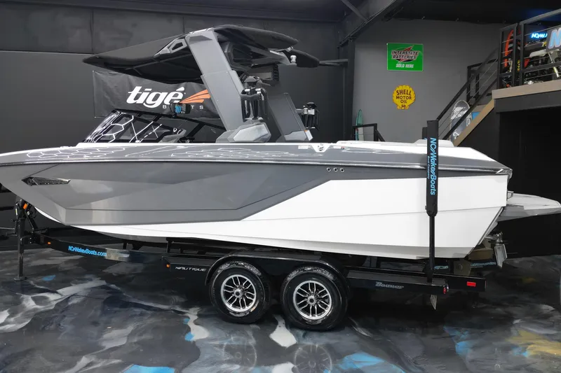 Slide: The Image of 2024 Nautique Super Air Nautique G23 boat on trailer in showroom. - 4