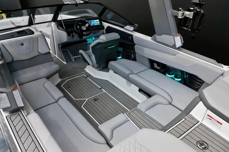 Slide: The Image of 2024 Nautique Super Air Nautique G23 interior with modern seating and illuminated features. - 7