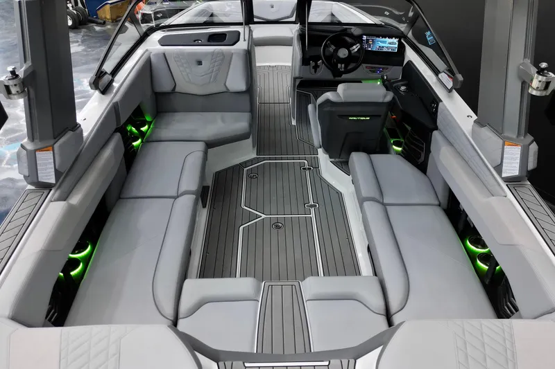 Slide: The Image of 2024 Nautique Super Air Nautique G23 interior with sleek seating and modern dashboard design. - 8