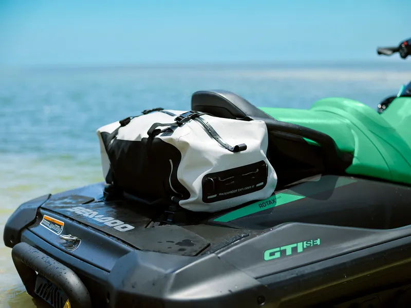 Slide: The Image of 2026 Sea-Doo GTI SE 130 iBR with waterproof bag at the beach. - 7