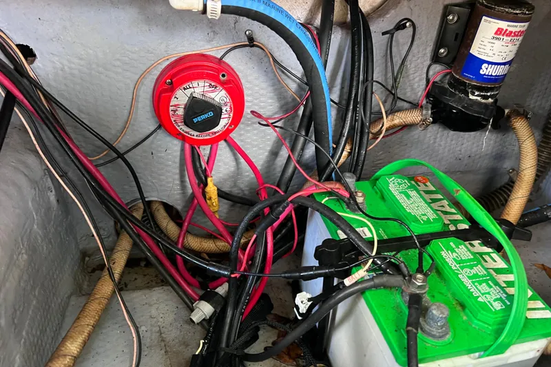 Slide: The Image of Electrical wiring and battery setup in a 1999 World Cat 246 SF boat. - 22