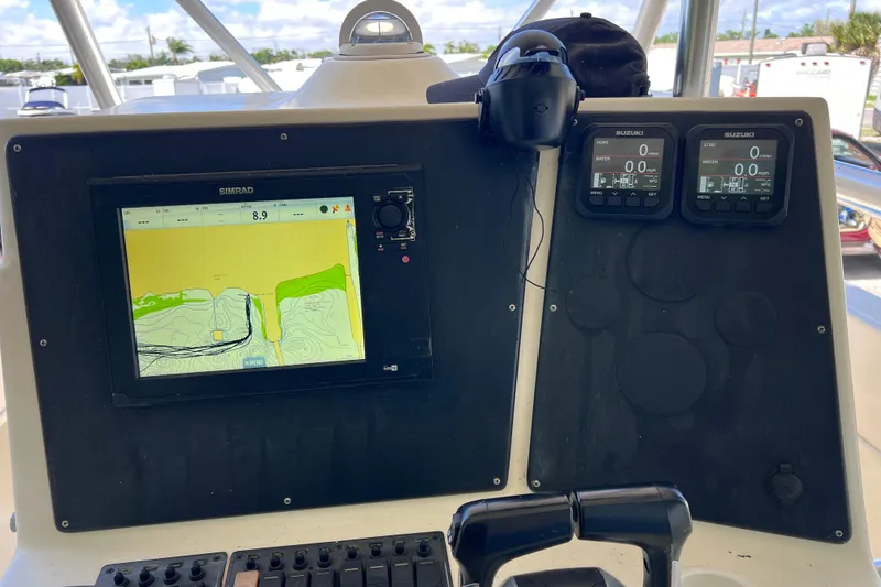 Slide: The Image of Control panel of a 1999 World Cat 246 SF boat with navigation display. - 25