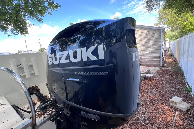 Slide: The Image of Suzuki 150 horsepower outboard motor on a 1999 World Cat 246 SF boat. - 3