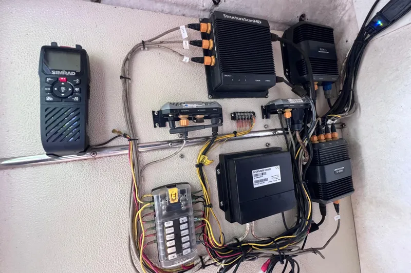 Slide: The Image of Electrical system setup on a 1999 World Cat 246 SF boat, featuring Simrad equipment. - 30