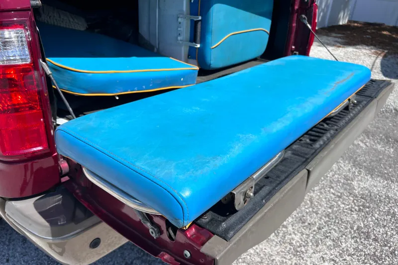 Slide: The Image of Blue boat cushions on a truck tailgate, World Cat 246 SF, 1999 model. - 34