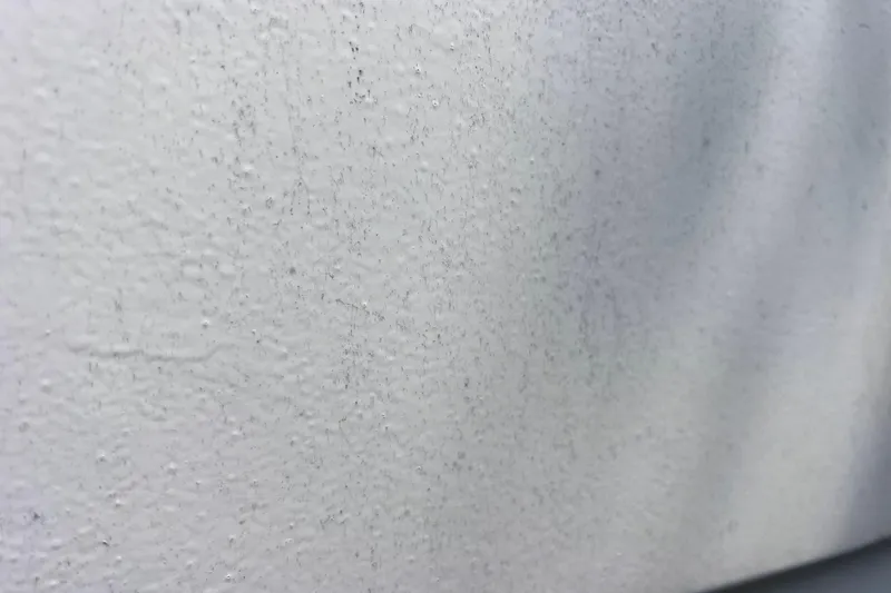 Slide: The Image of Close-up of textured white surface on 1999 World Cat 246 SF boat. - 47