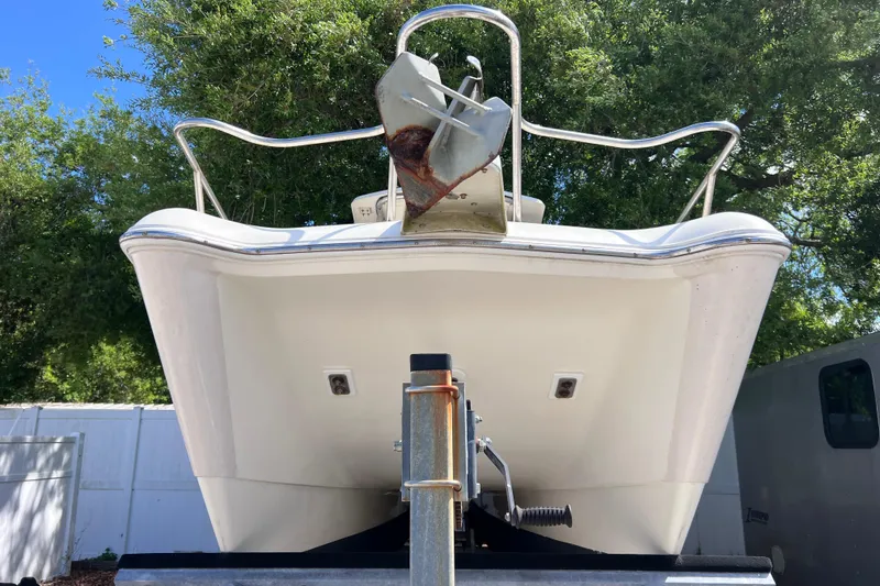 Slide: The Image of Front view of a 1999 World Cat 246 SF boat on a trailer. - 5