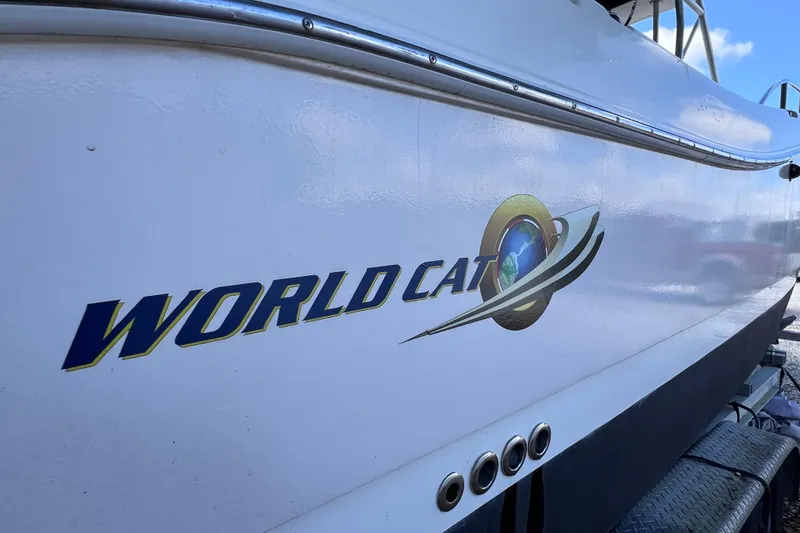 Slide: The Image of Side view of a 1999 World Cat 246 SF boat with logo. - 7