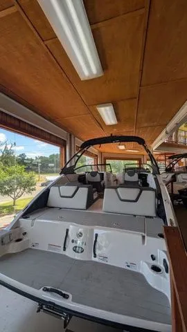 Slide: The Image of Yamaha AR250 2026 boat parked indoors. - 2