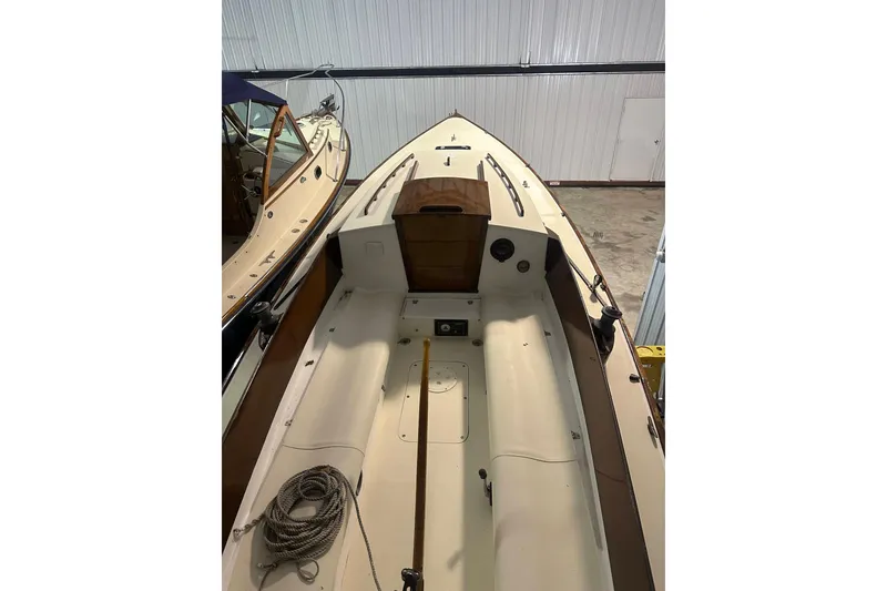 Slide: The Image of 1998 Bridges Point BP 24 sailboat interior, featuring a clean deck and coiled rope. - 8