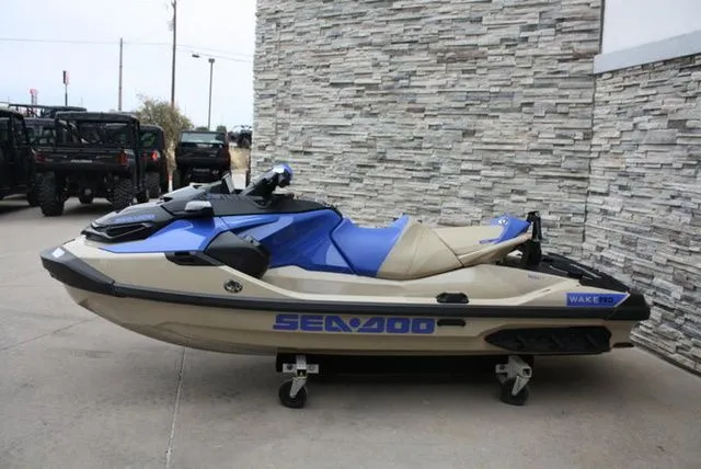 Slide: The Image of 2026 Sea-Doo Wake Pro 230 jet ski in blue and beige. - 5