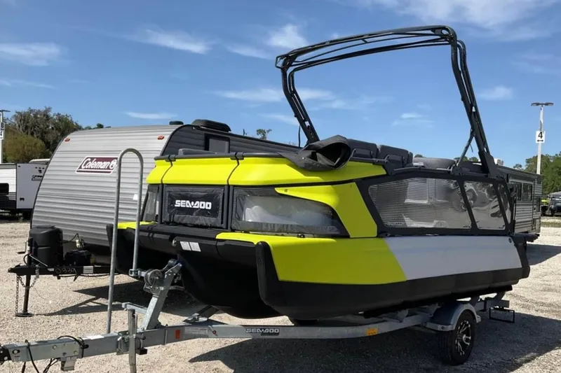 The Image of 2024 Sea-Doo Switch Cruise 18 on trailer, parked near Coleman camper. - 0