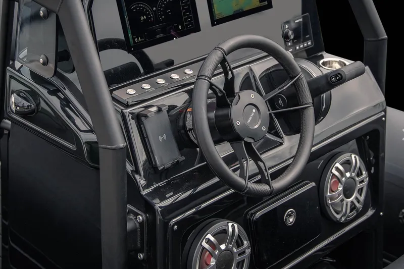 Slide: The Image of Steering console of 2026 Brig Navigator 20 boat with modern controls and speakers. - 10