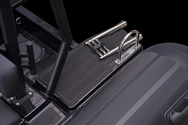 Slide: The Image of 2026 Brig Navigator 20 boat interior with sleek black design and stainless steel fittings. - 12