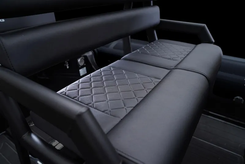 Slide: The Image of Luxurious seating detail of 2026 Brig Navigator 20 boat with diamond-pattern upholstery. - 15
