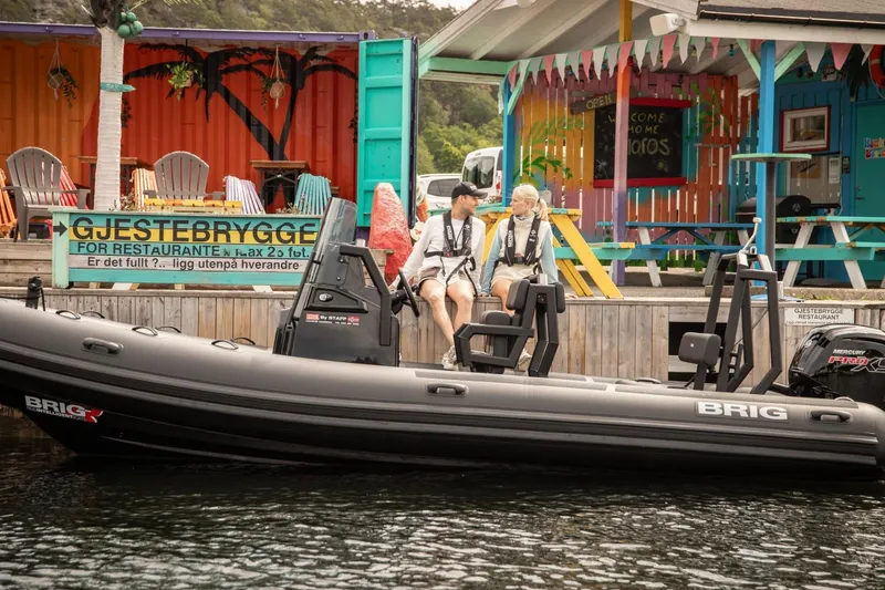 Slide: The Image of Brig Navigator 20 boat at colorful dock, 2026 model. - 17