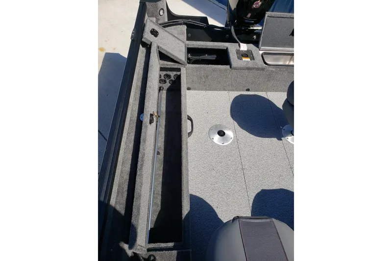 Slide: The Image of 2026 Alumacraft Voyageur 175 Sport boat interior with storage compartment and seating. - 20