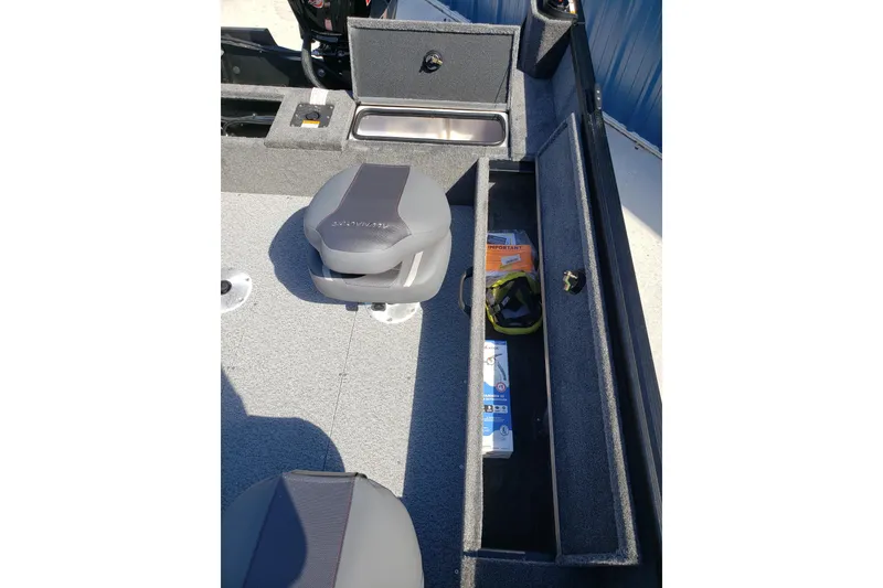 Slide: The Image of 2026 Alumacraft Voyageur 175 Sport interior with seating and storage compartments. - 21