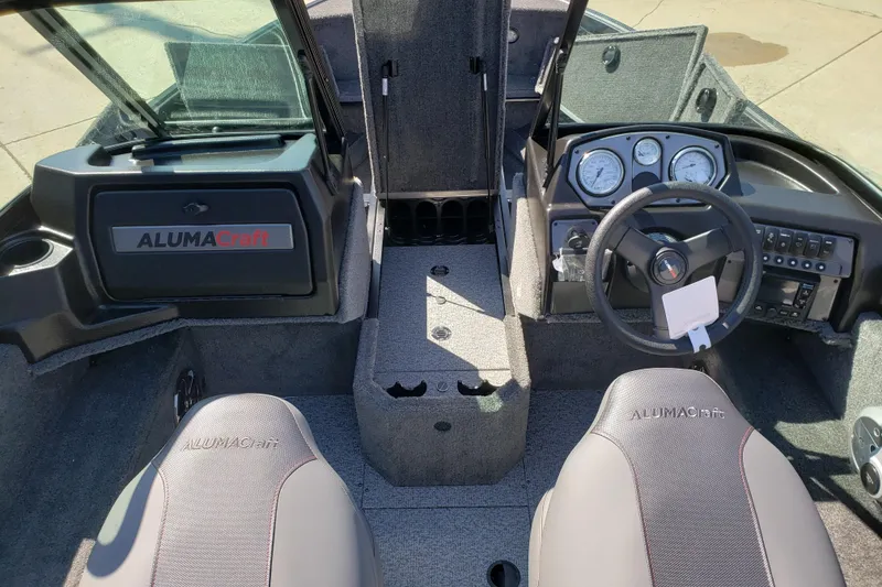 Slide: The Image of Interior view of 2026 Alumacraft Voyageur 175 Sport boat, featuring dashboard and seating. - 23