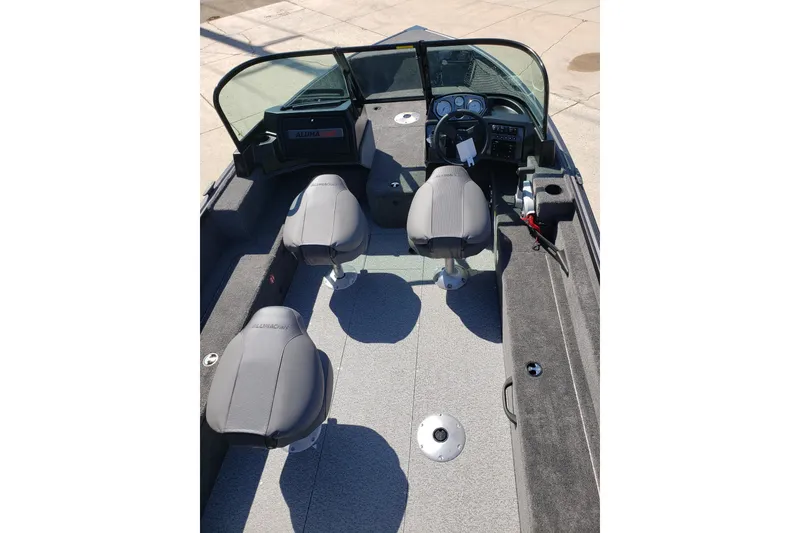 Slide: The Image of 2026 Alumacraft Voyageur 175 Sport boat interior with seating and steering console. - 27