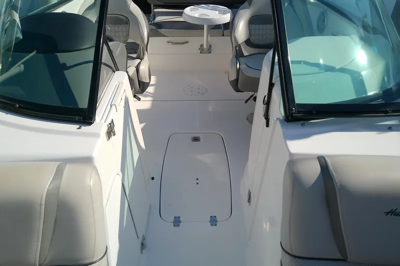 Slide: The Image of 2021 Hurricane SunDeck 2410 OB interior with seating and table, showcasing spacious design. - 12