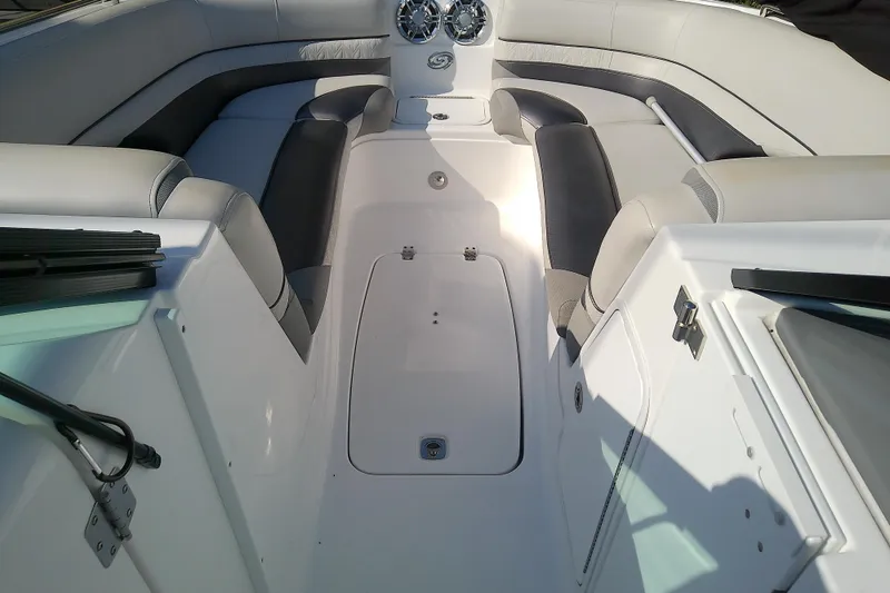 Slide: The Image of Interior view of 2021 Hurricane SunDeck 2410 OB boat, featuring spacious seating and sleek design. - 13