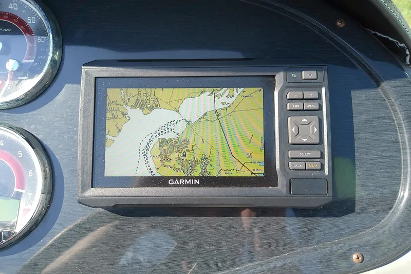 Slide: The Image of Garmin GPS on 2021 Hurricane SunDeck 2410 OB boat dashboard, displaying nautical map. - 16