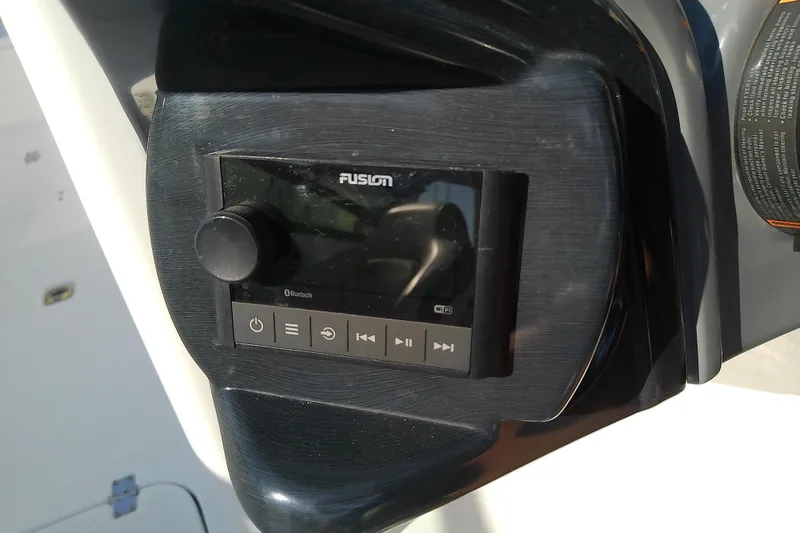 Slide: The Image of Fusion audio system on 2021 Hurricane SunDeck 2410 OB boat dashboard. - 17
