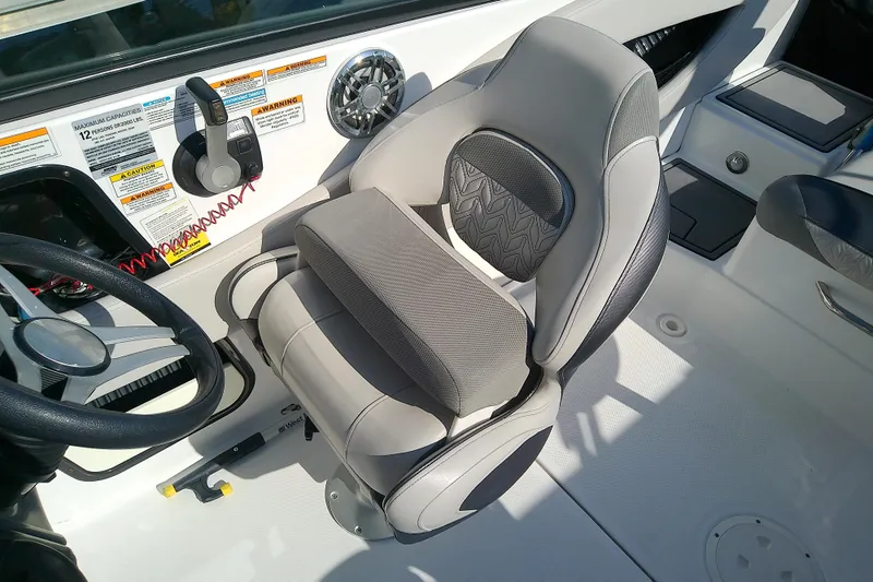 Slide: The Image of Captain's seat and controls of 2021 Hurricane SunDeck 2410 OB boat. - 21
