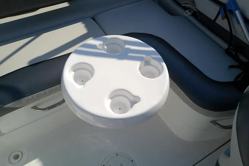 Slide: The Image of Cup holder on a 2021 Hurricane SunDeck 2410 OB boat interior. - 25